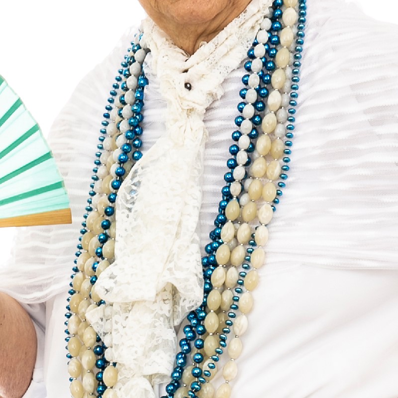 A detail view of the Fan accessory from the Mama Vieja costume