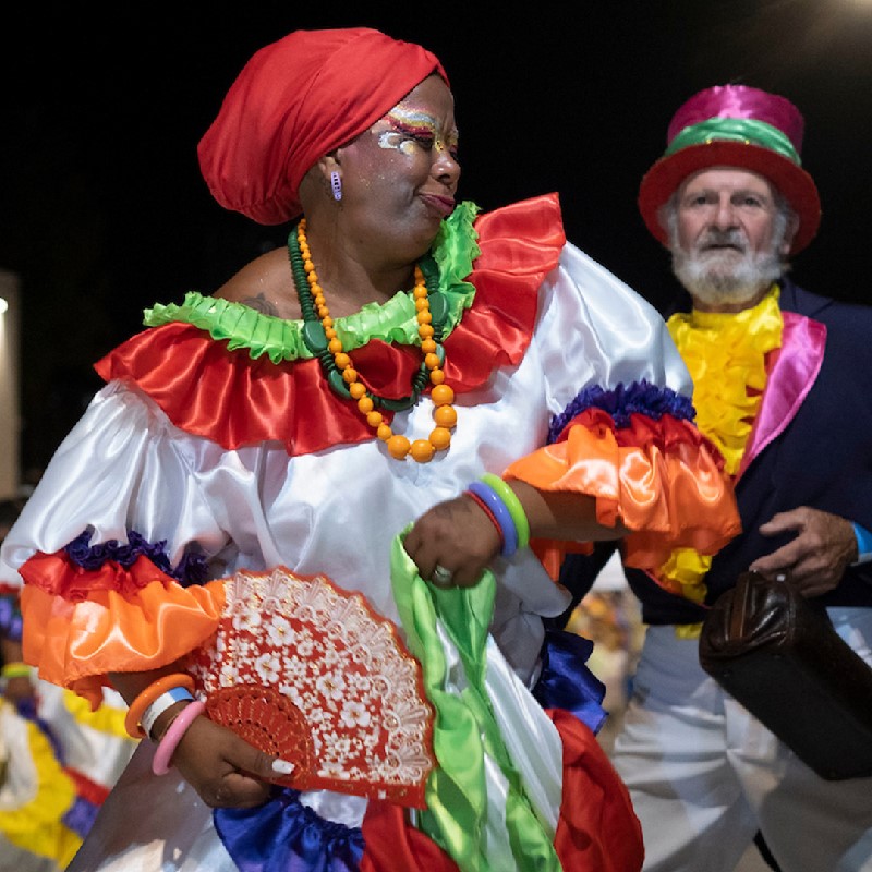 An image of a womn dancing in her Mama Vieja costume