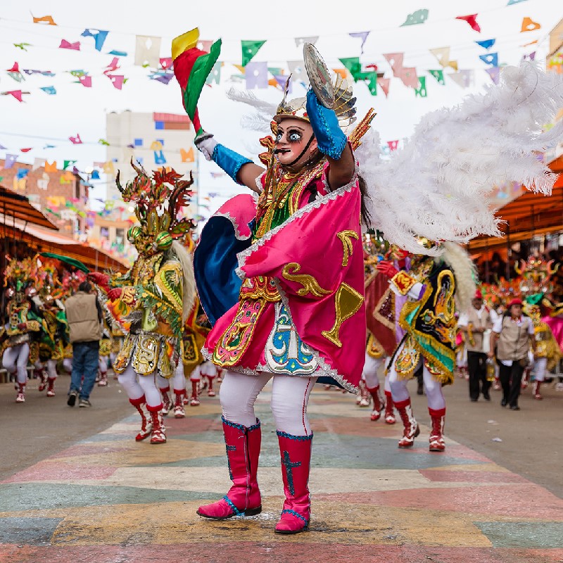 A photo of the Oruro Carnival and people dressed in Diablada costumes