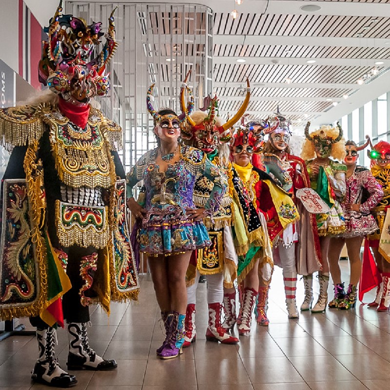 People standing side by side representing the different characters of the Diablada