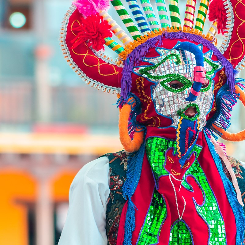 an imageof someone dressed in an elaborate Inti Raymi costume